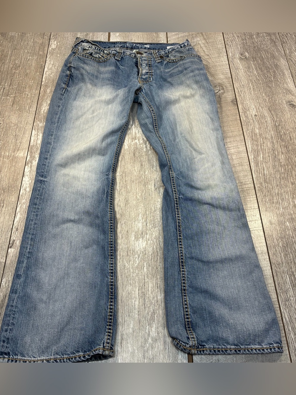 Guess women’s Falcon Slim Bootcut jeans with light wash and button fly size 32